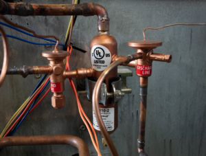 Hot gas reheat unit